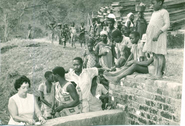my mother dispensing medicine to the villagers on the coffee farm Tukumbi